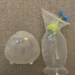 Haakaa Breast Pump with Suction Base and Flower Stopper and Haakaa Ladybug