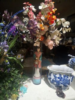 Imitation flowers.
With a geisha doll