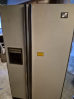 Vintage, frig with ice maker.