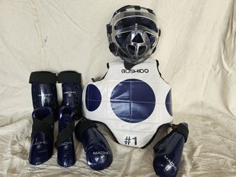 Macho Dyna 9 piece blue sparring gear set with shin guards, chest gear, and face shield for small child