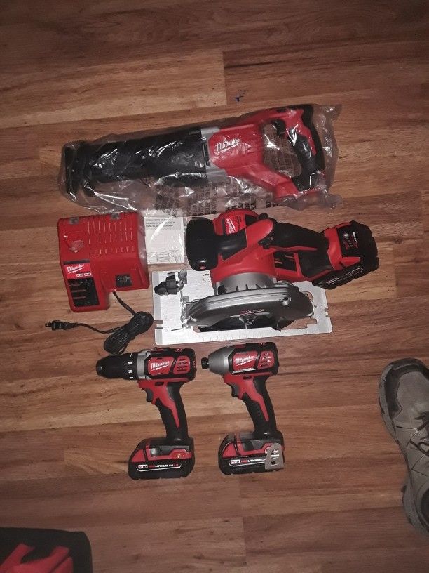 Milwaukee M18 4 Tool Kit With Three Batteries Charger And Carry Bag