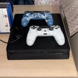 PS4 Slim + 2 Controllers/Games