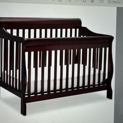 Delta Luv 4-in-1 Adjustable Crib And Matching Changer