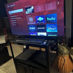 50’’ ROKU TLC TV WITH ROLLING CART USED
