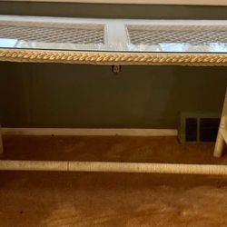 White Rattan Coffee Table and 2 End Tables and A Console Table With Glass Table Tops and A Mirror