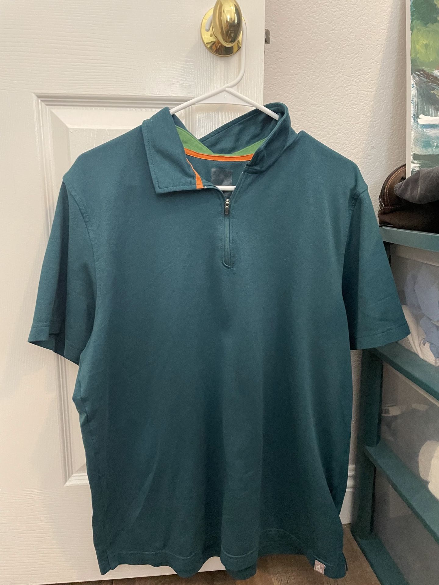 The North Face Teal Polo Mens Shirt with Orange Accent