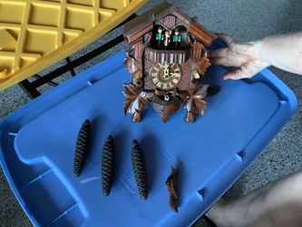 Vintage working cuckoo clock wooden has weights , missing one bird, by Chicago Clock and company