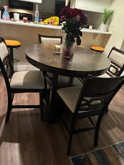Brown wood Dinner table and chairs.