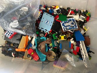Over 30 pounds of LEGO assorted bricks and manuals