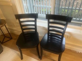 Two pottery barn black wooden chairs