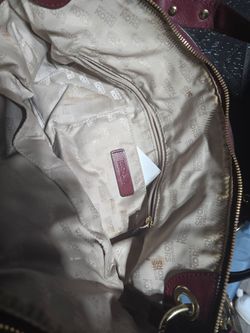 Michael Korr's burgundy leather purse