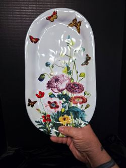 Juliska Field of Flowers 13.5-inch ceramic oval hostess tray featuring a colorful poppy design and whimsical butterflies. 14"×7.5"