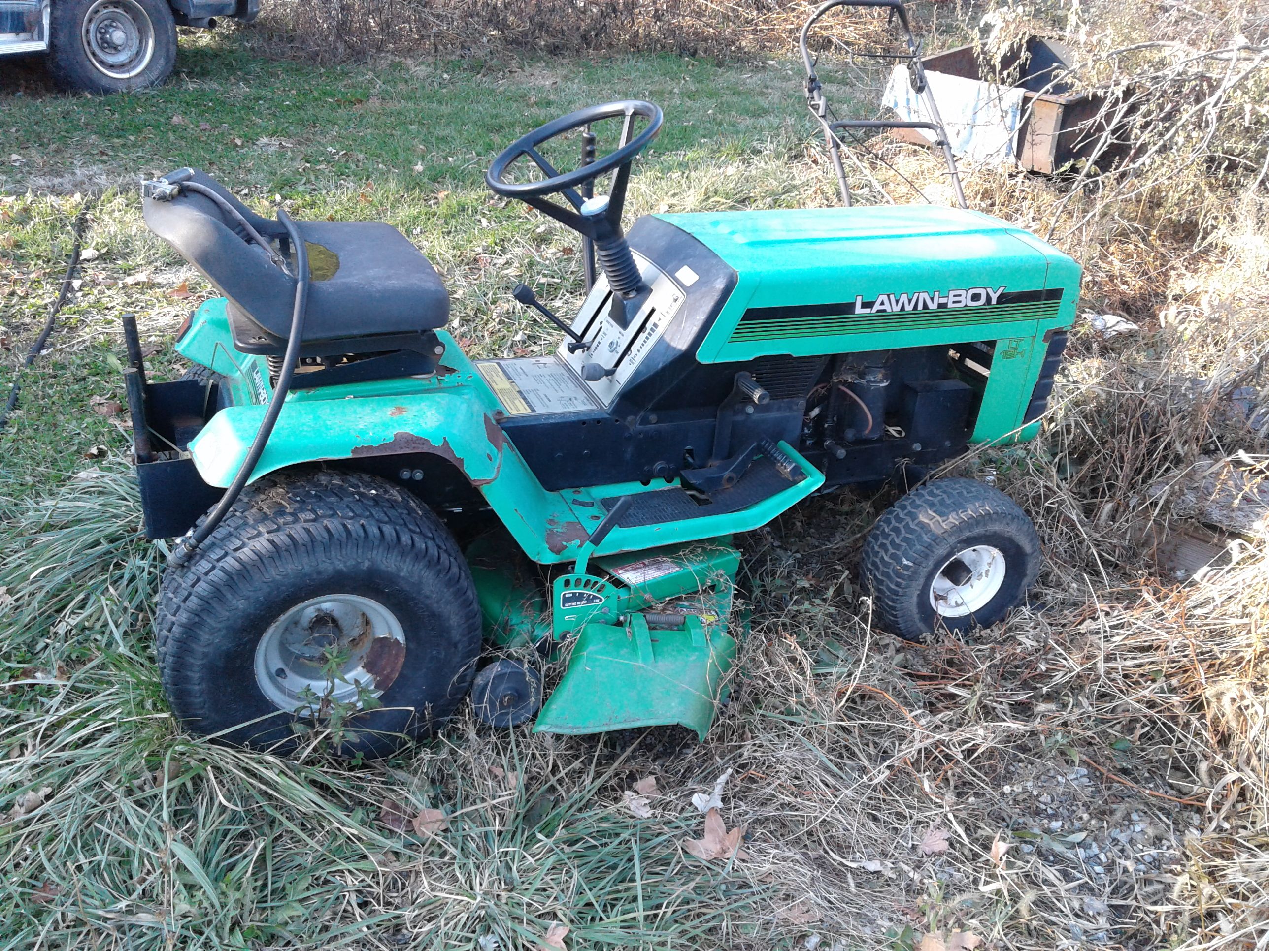 Lawn boy riding mower