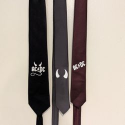 Ties with the AC/DC logo in burgundy, gray, and dark gray.