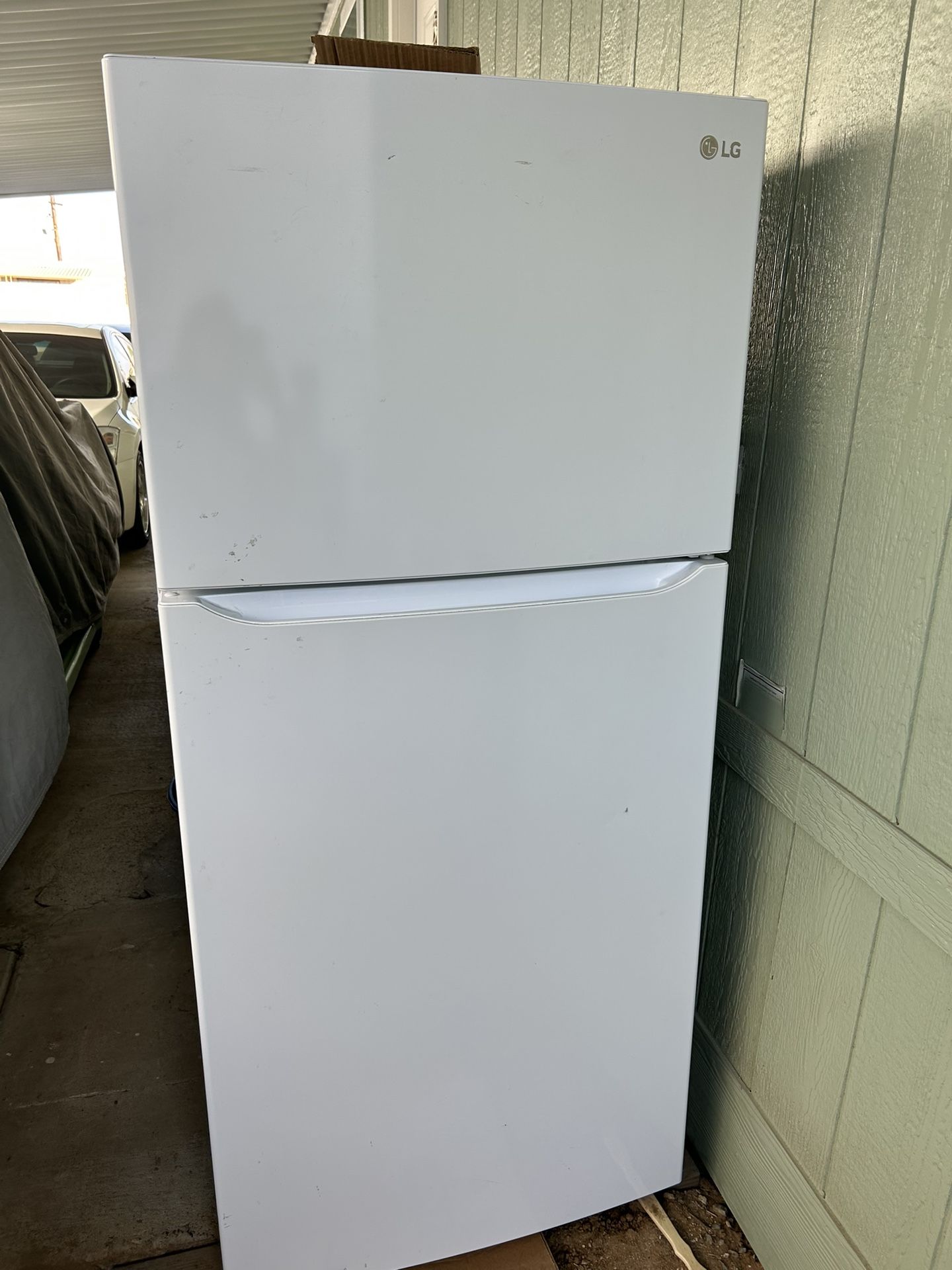 LG top-freezer refrigerator in white