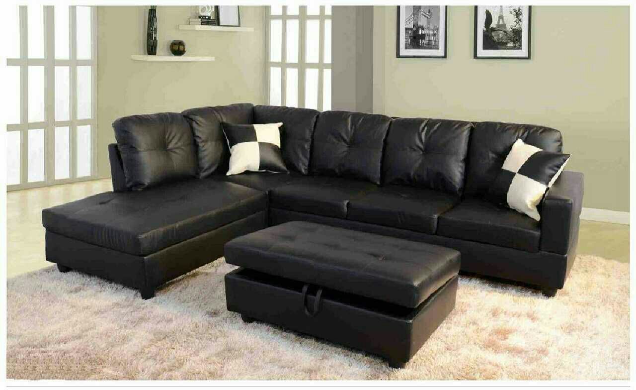Black faux leather sectional with ottoman has storage ( new )