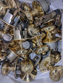 Whole house worth of brass door hinges and round door knob handles. Everything works perfectly. Comes with all the screws. We just swapped out f