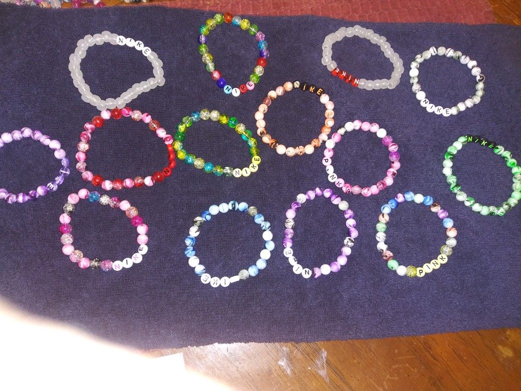 Nike. Pink. Bracelets