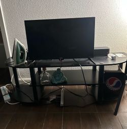 24” Roku Tv / sound bar works good and loud/  tv stand