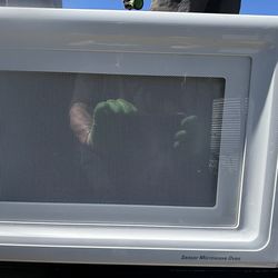 Used white colored General Electric microwave