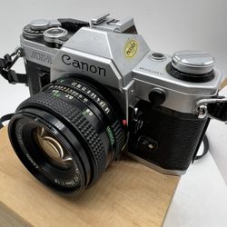 Canon AE-1 35mm SRL Film Camera w/ 50mm FD Lens w/ Canon A2 Power Winder, case + 