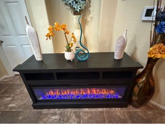 Beautiful fireplace /tv stand in excellent condition 63” inch long