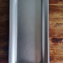 Silver rectangular charger plate with beaded-edge plastic tray