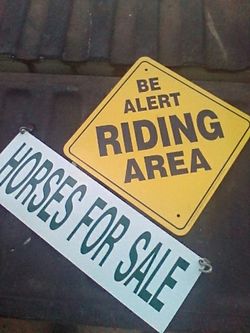 Horse signs one for sale and one be alert riding area