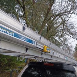 32 And A 40 Ft Werner Ladder With Adjustable Legs 