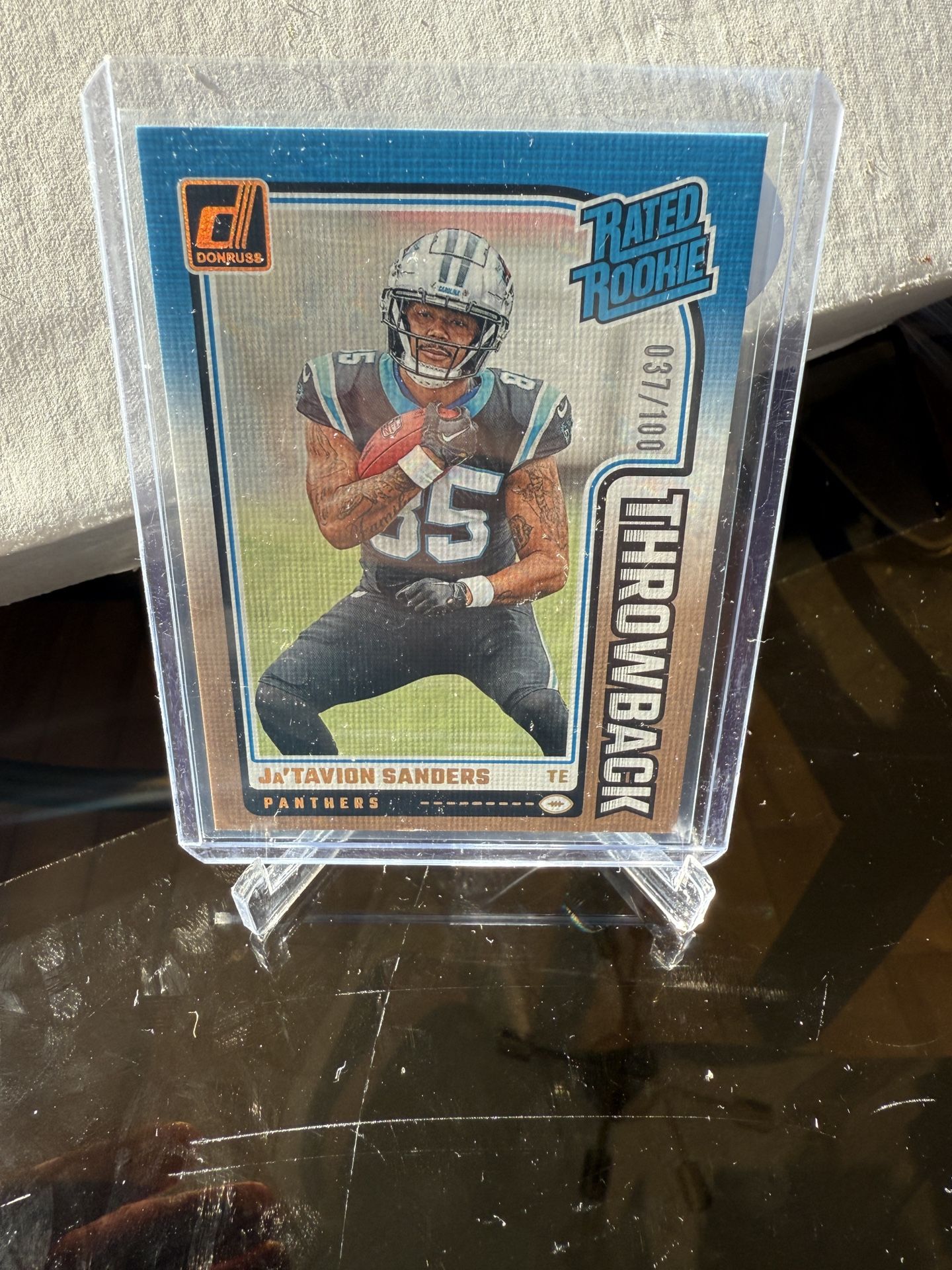 2024 Panini Donruss Rated Rookies Throwback Studio #26 Ja'Tavion Sanders /100