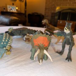 Lot of various 8-12” dinosaurs some genuine Jurassic Park 