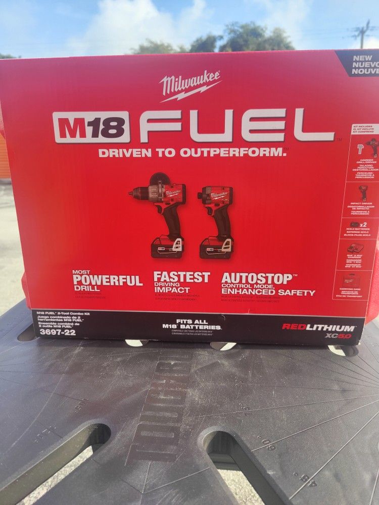 Milwaukee Fuel Hammer Drill, Impact Driver, 2 5ah Batteries, Charger And Case