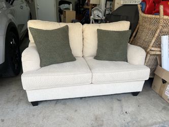 Cream loveseat couch