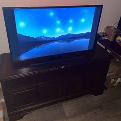 Flat Screen LED TV And Entertainment Center