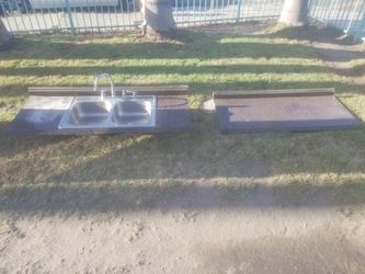 Countertop with faucet and sink$40