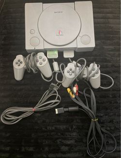 Original PlayStation with 2 Controllers, 1 Memory Card, 13 Games, and 2 Cheater Books