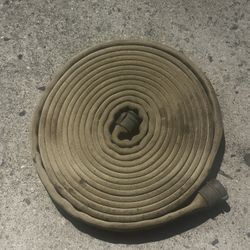 ANTIQUE FIRE HOSE WITH FITTINGS. AMAZING CONDITION FOR ITS AGE.
