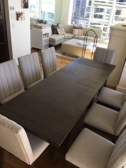Ashley 9-Piece Extendable Dining Set — Table + 8 Upholstered Chairs — $650