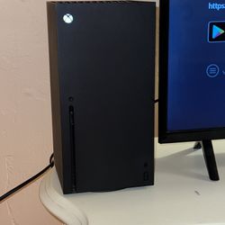 Xbox series X with controller and cords