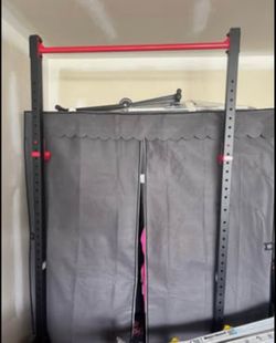 Weight bench and high bar set, no weights included.