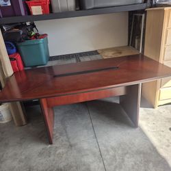  boat-shaped wood conference table