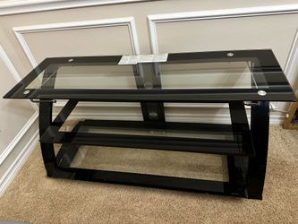 3 tier Black glass TV stand with shelves. 23”x50”