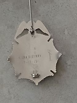 Silver fire fighter badge