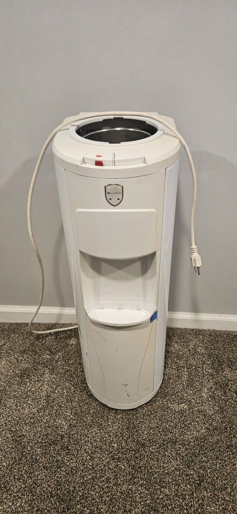 Glacier Bay water dispenser. 
120V 60Hz 4.65 A
Water bottle sits on top.