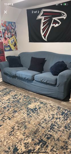 Blue couch with pillows