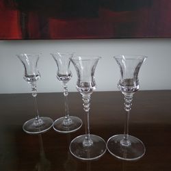 Two pairs of clear glass candlestick holders with flared tulip-shaped cups and beaded stems by Mikasa