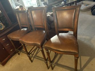 Three Leather Chairs