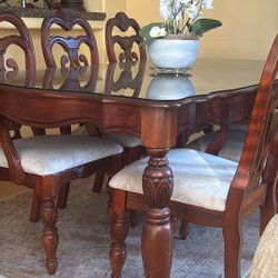 Very Clean And A Spotless Dining Table With Six Chairs