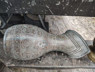 Intricately designed bronze Pitcher with detailed patterns. $100 Located Mount Dora Fla 32757