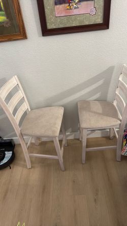 Two off-white barstools